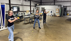  Three interns practice using tasers